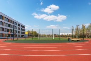 in,the,school,yard:,an,red,artificial,turf,running,track